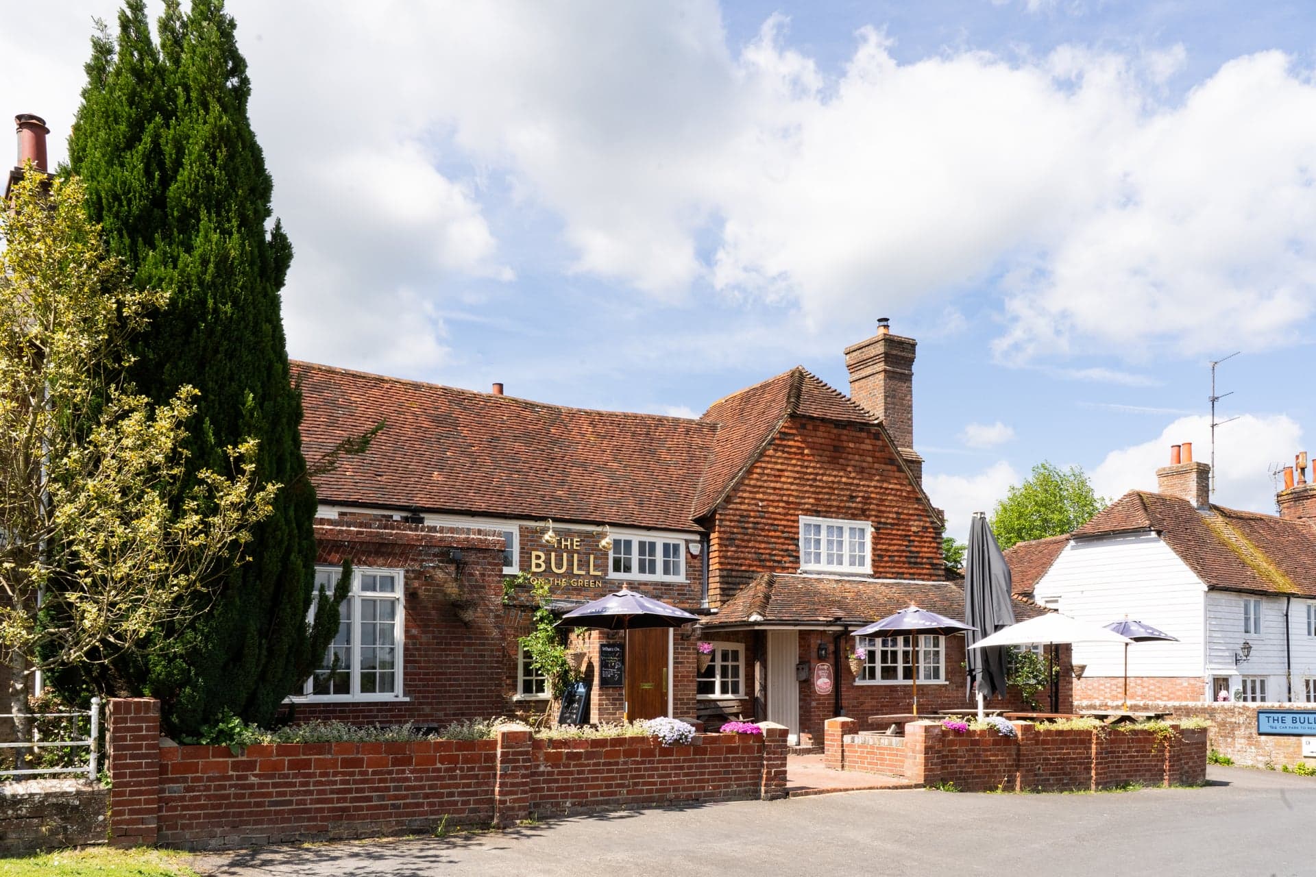 The Bull on the Green pub exterior on a sunny day in Newick, East Sussex