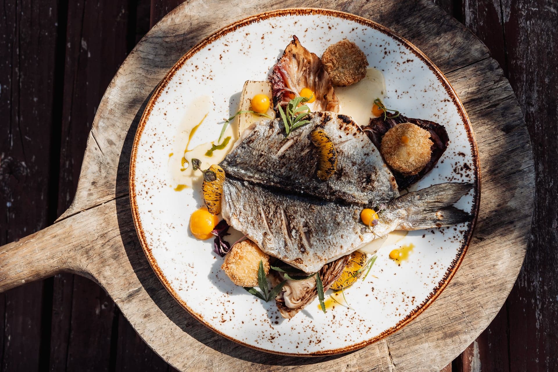 Chef-prepared pan-fried sea bream at The Bull on the Green restaurant